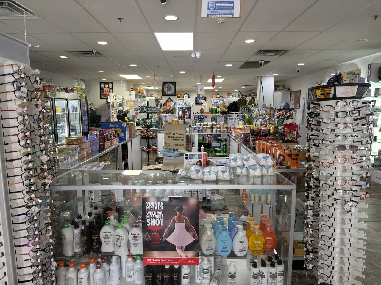 Interior of Patient Care Pharmacy with stocked health products and eyewear displays